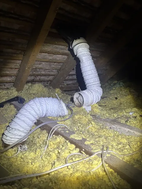 Detached extractor ducting within a roof space