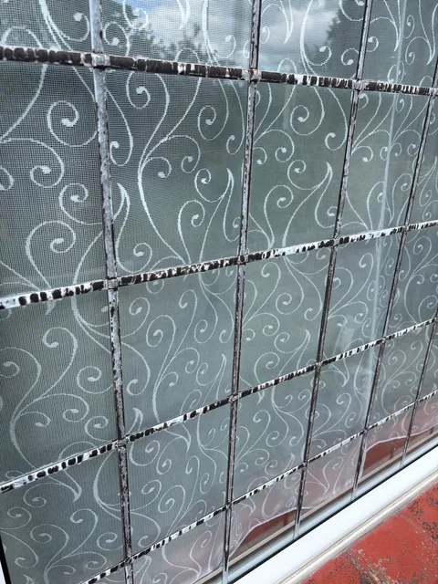 Corrosion to metal components of an older leaded window in Hayling Island