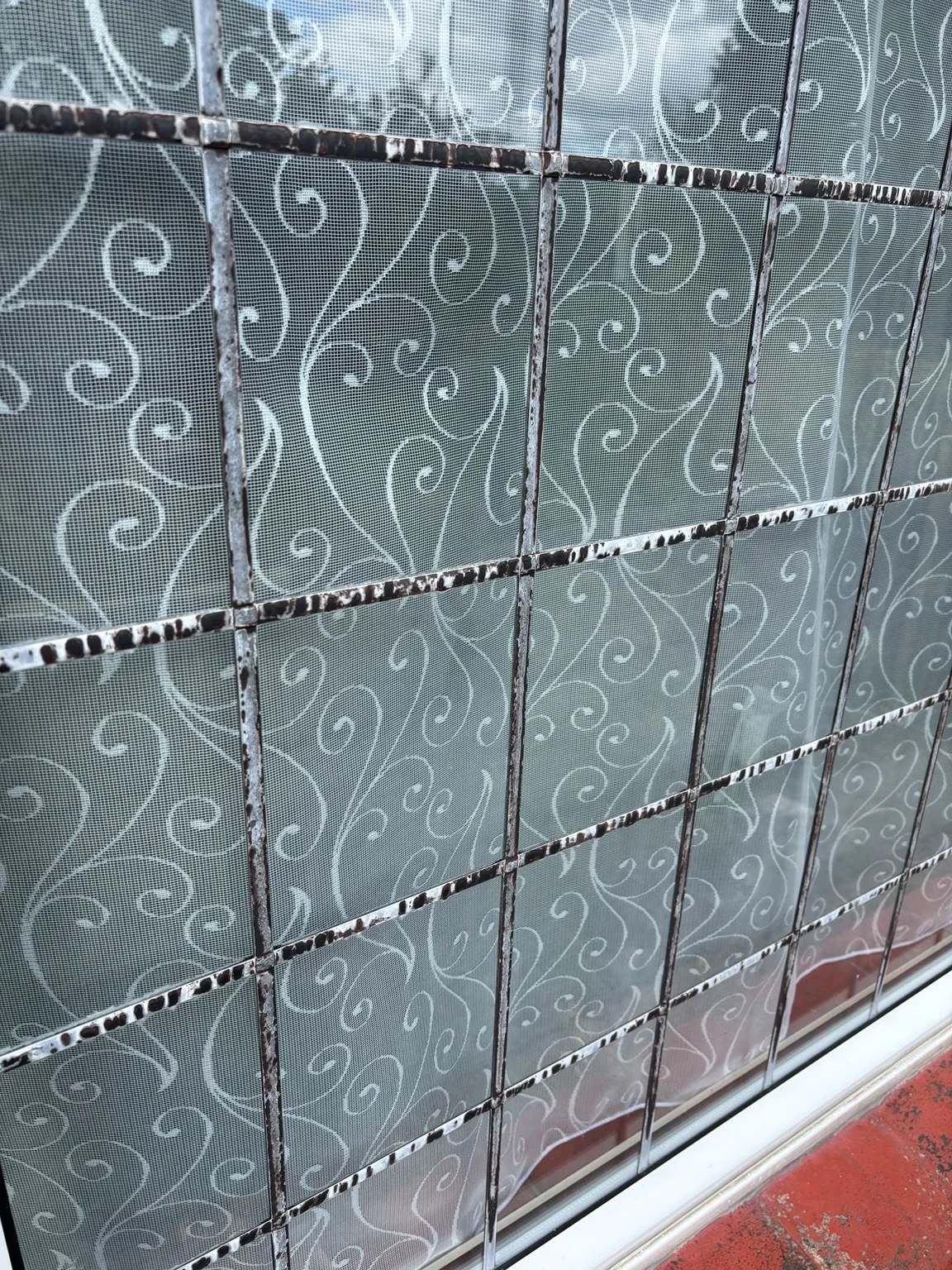 Corrosion to metal components associated with an older leaded window at a coastal property in Hayling Island