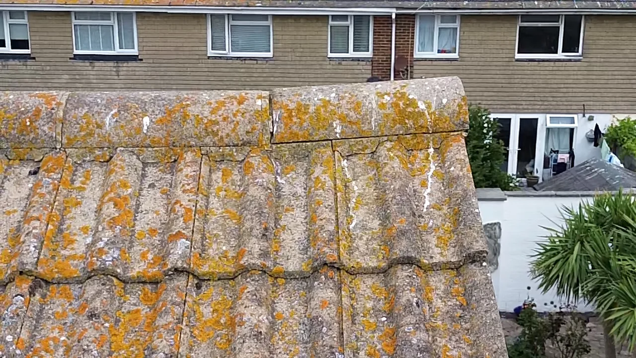 Loose ridge tile on a coastal roof