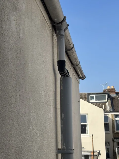 Rainwater downpipe connected into a soil pipe at a Portsmouth terrace house