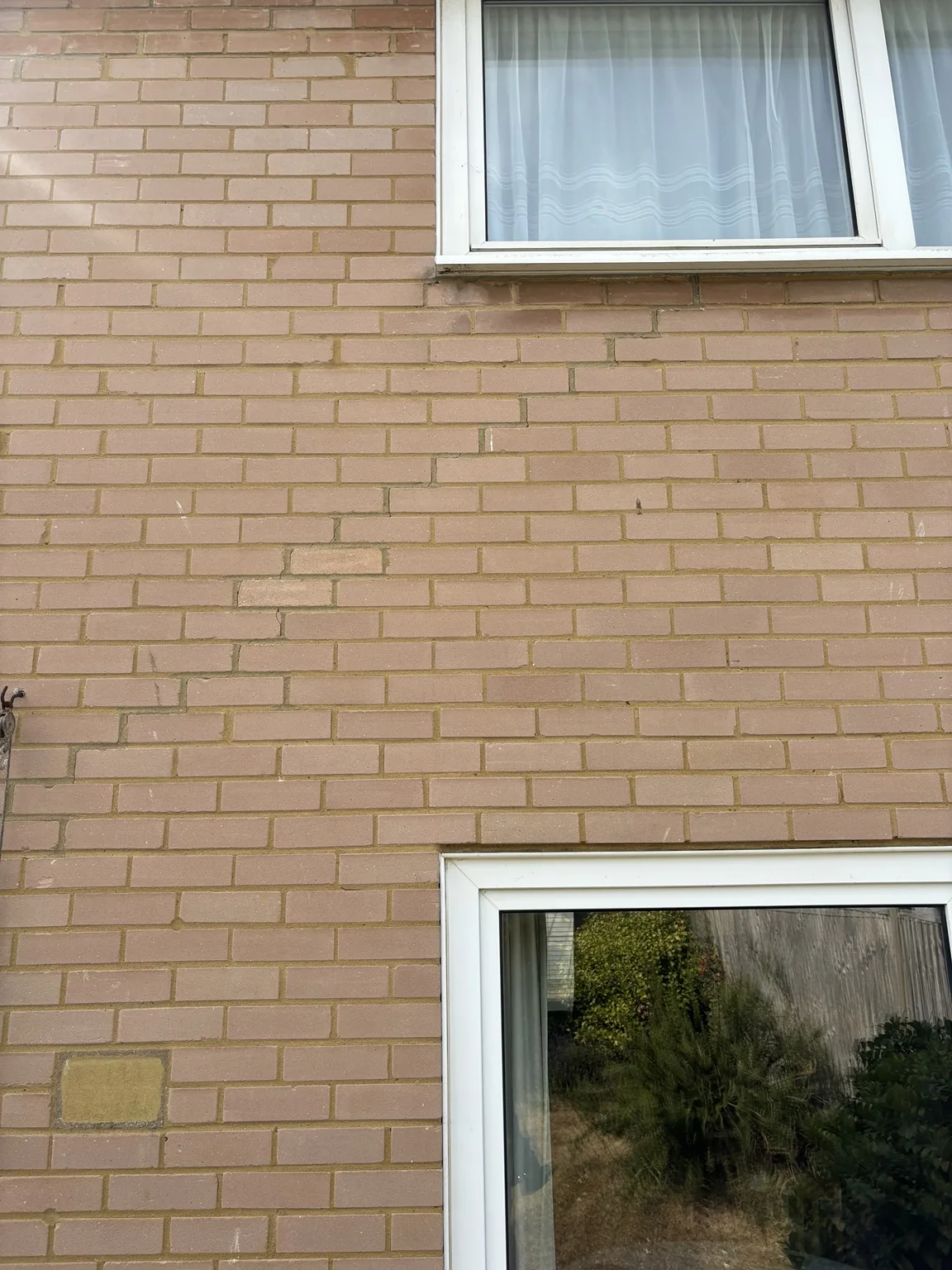 Stepped cracking above a window opening