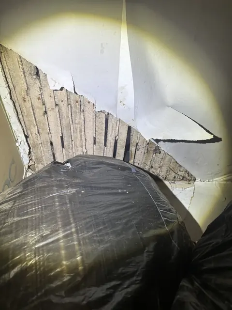 Exposed laths following water damage to a ceiling