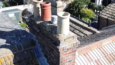 Shared chimney stack with open pots in Worthing
